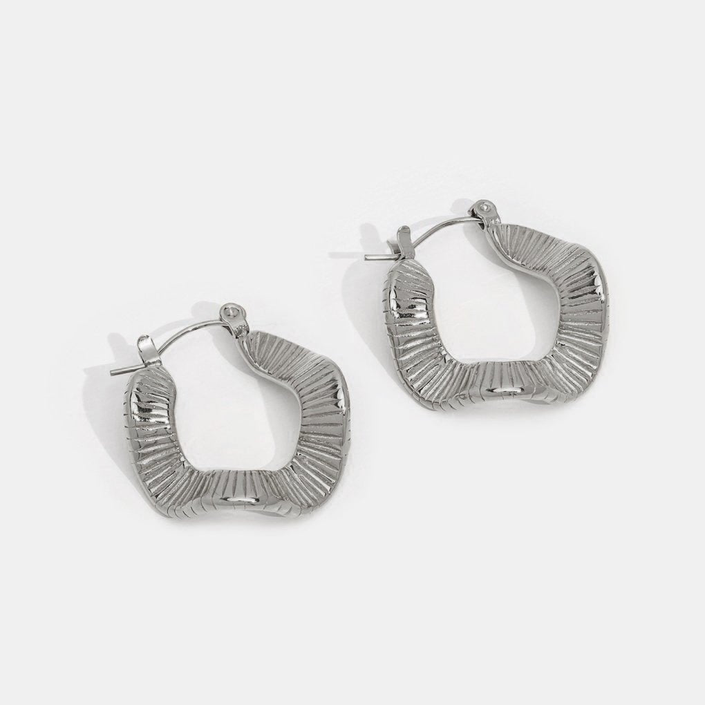 Silver hoops with geometric pattern