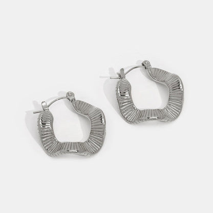 Silver hoops with geometric pattern